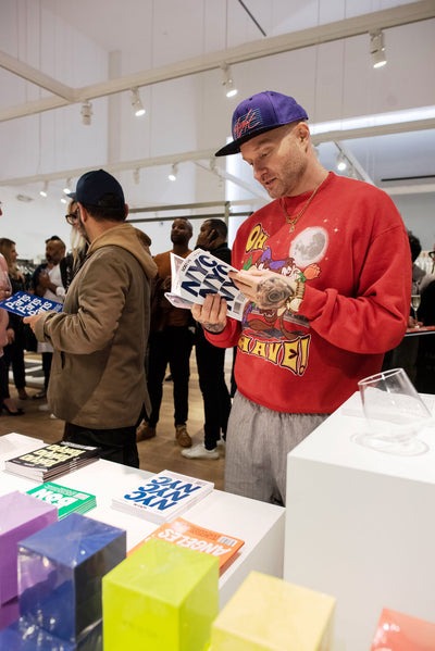 man reading LOST iN NYC guide book