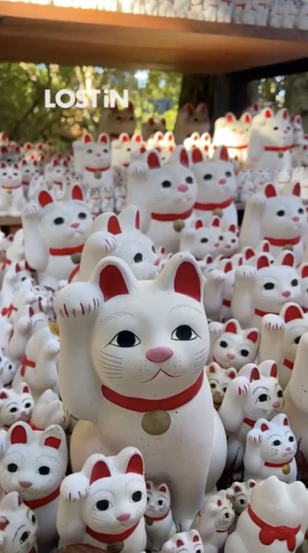 <strong>Gotokuji cat temple Tokyo.</strong> Hundreds of tiny white paws raised in silent greeting—Gotokuji Temple is more than just Tokyo’s “Cat Temple.” It’s the birthplace of the iconic maneki-neko, the beckoning cat said to bring good fortune.